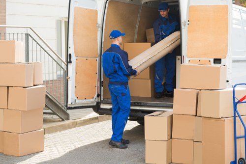 Man and van loading furniture in Kentish Town residential street