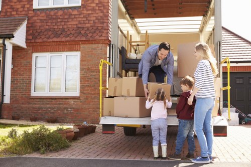 Furniture and boxes being loaded by a local moving team