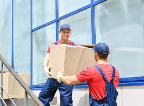 Final delivery of boxes and furniture into a new property