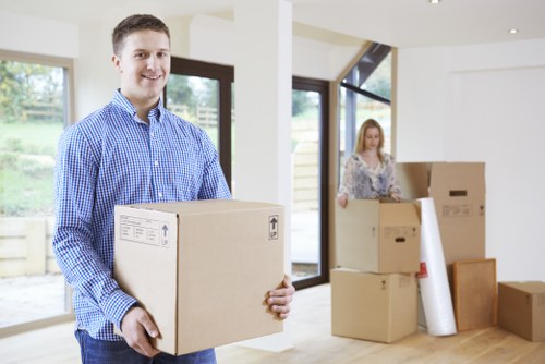 Trained removal staff handling boxes and furniture carefully