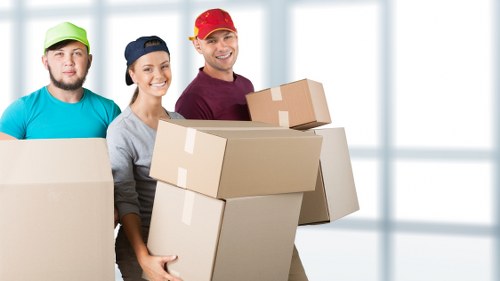 Furniture and boxes being loaded for a Kentish Town removal service
